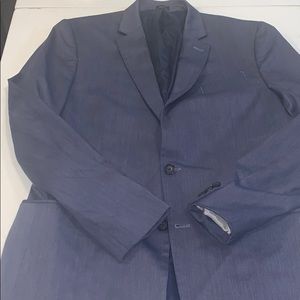 A sports coat. Navy blue. Very chic.